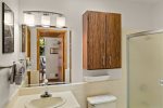 Shared bathroom with a walk-in shower